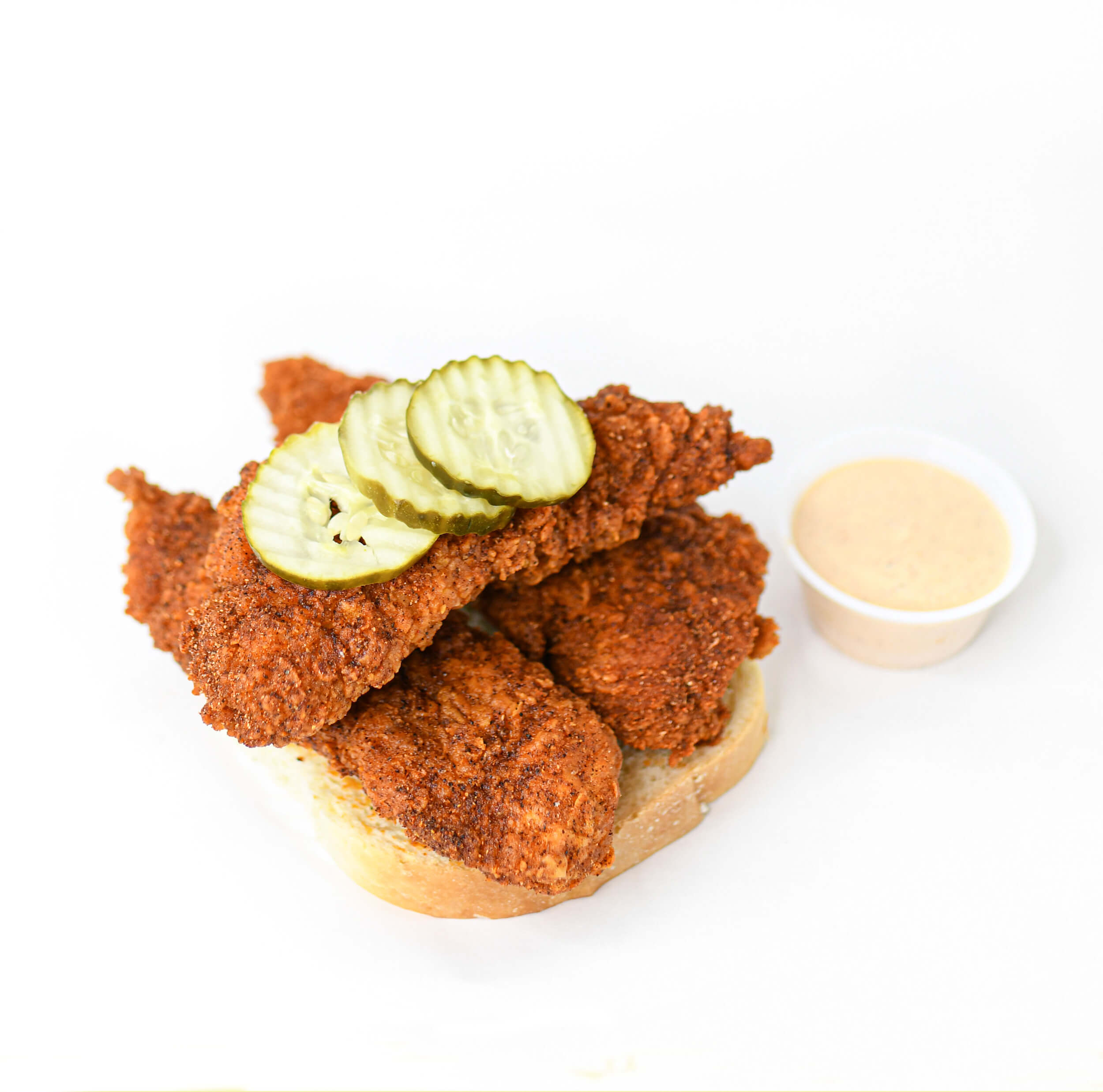 Pretty Bird Chicken 3 Piece Crispy Tender with pickles and sauce