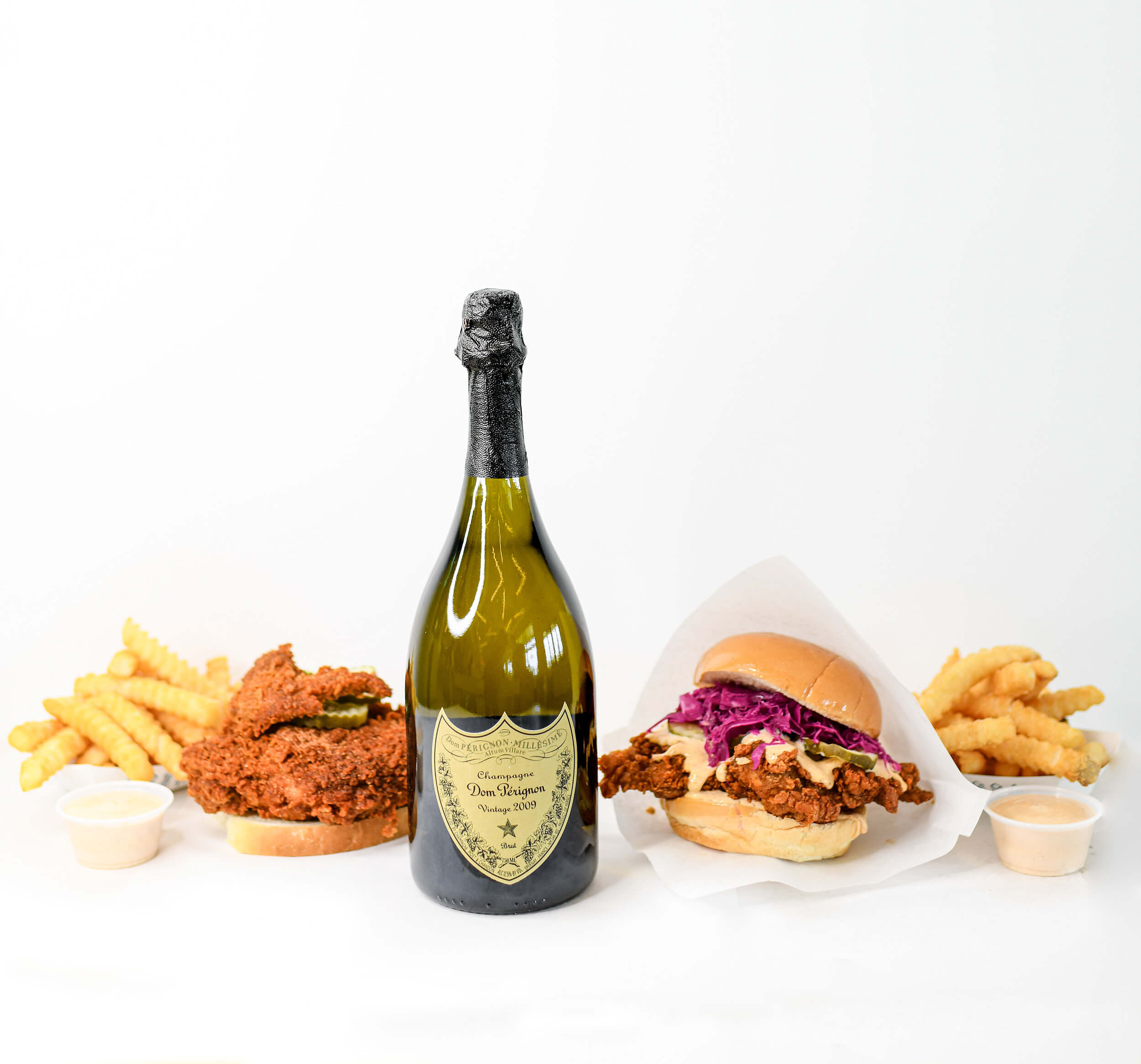 Pretty Bird Chicken Combo with a bottle of Dom Perignon with the option of two chicken combos